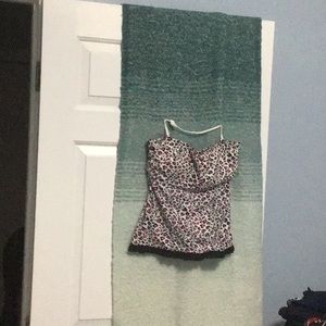 Very cute little tankini in hot pink and black on white background.